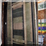 R91. Contemporary rug in charcoal, tan and sage green.